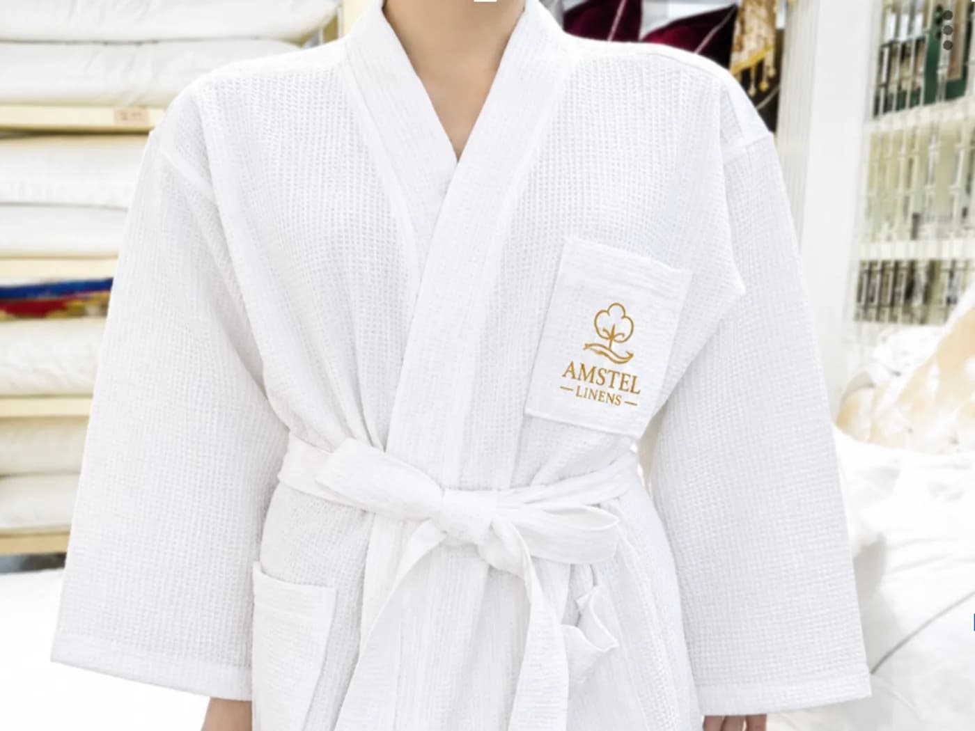 White hotel bathrobe for guest rooms and spas
