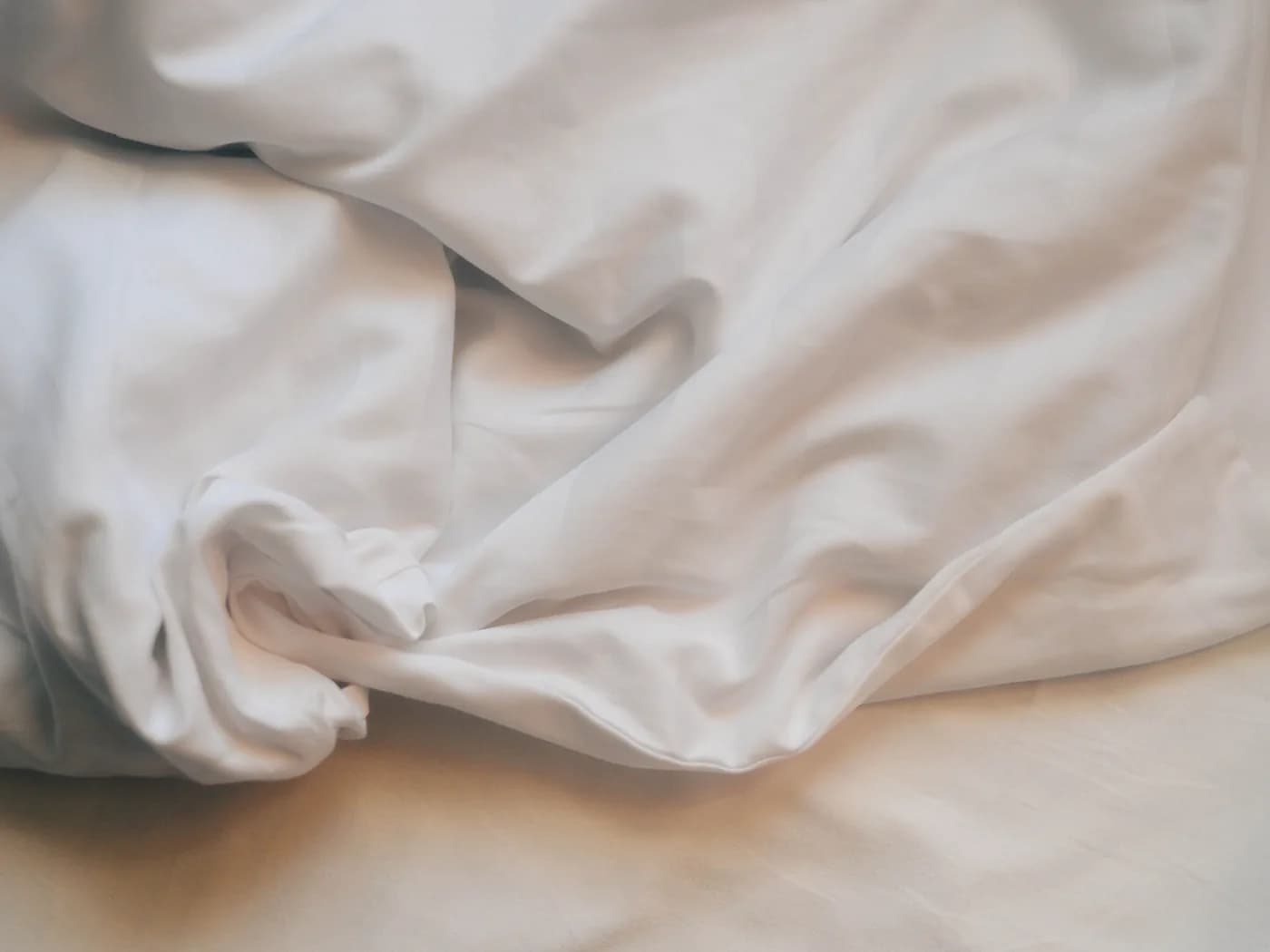 Crisp white flat sheets for hotel beds