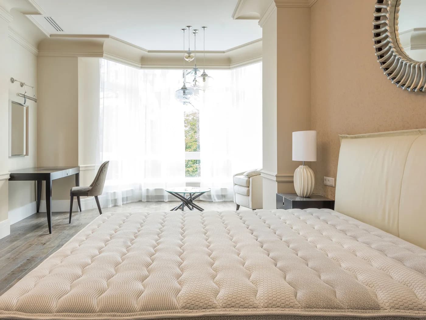 Comfortable mattress topper displayed on a hotel bed